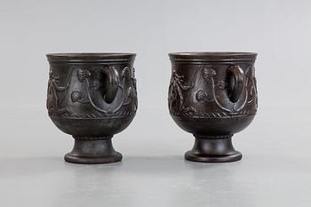 Ivar Johnsson, a pair of Swedish Grace cast iron jardinières, 'Diana' by Näfveqvarn, Sweden 1920's.