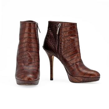 CHRISTIAN DIOR, a pair of brown leather boots.