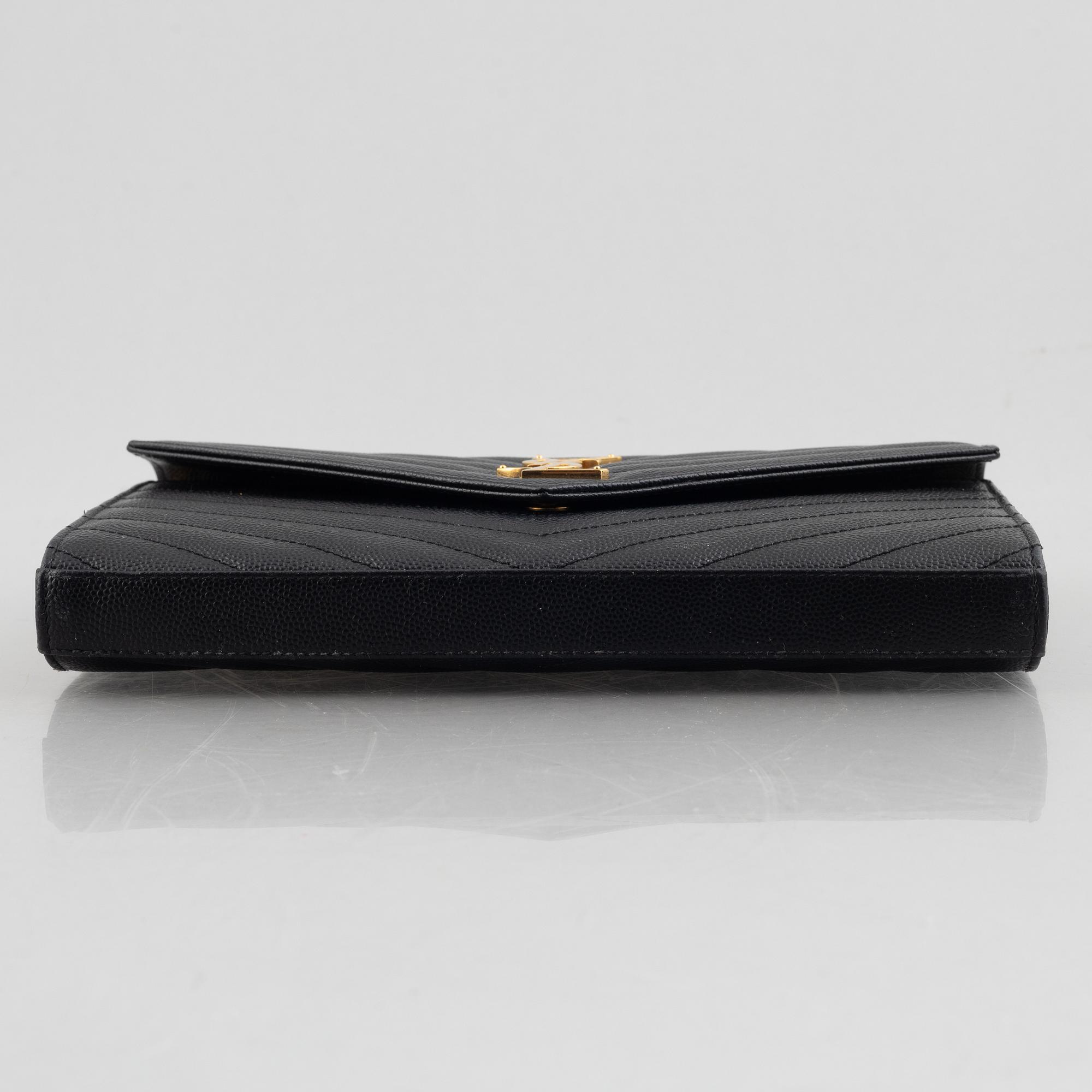 Yves Saint Laurent, a handbag/clutch.