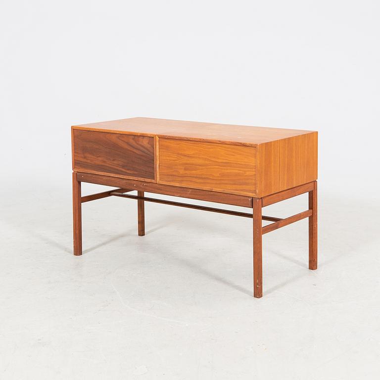 A 1960s teak side table.