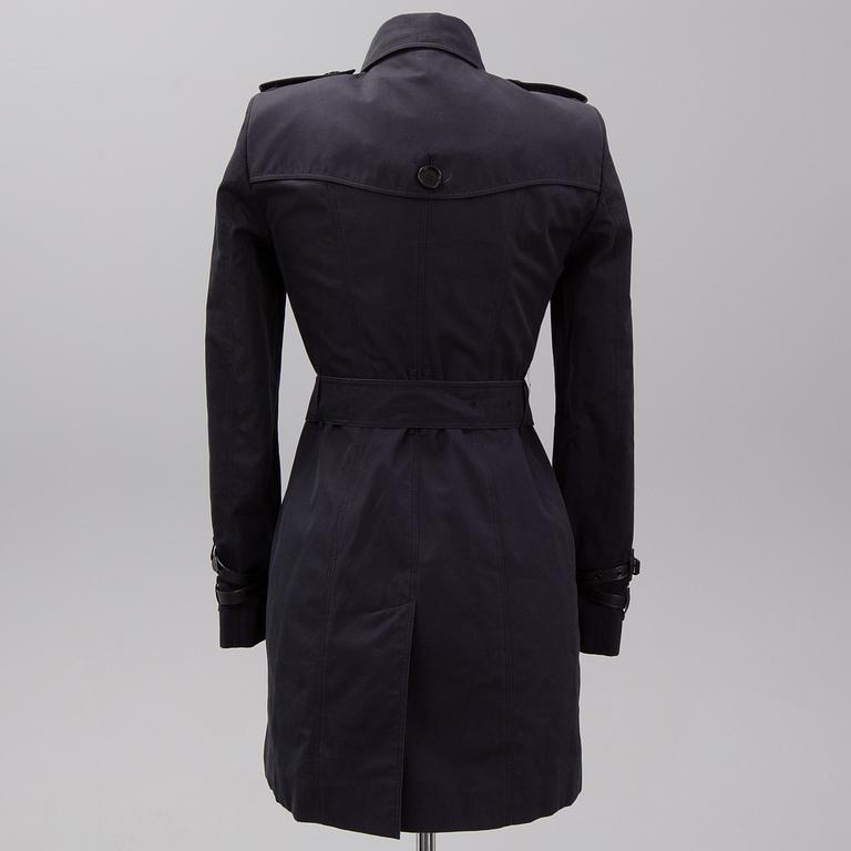 Burberry, a black cotton trenchcoat, UK size 8 (36).