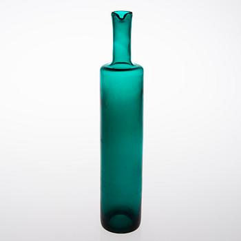 A glass bottle signed Nanny Still Riihimäen Lasi Oy.