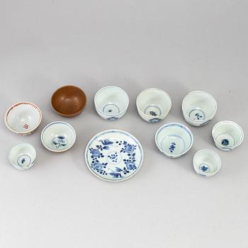 Eleven porcelain cups with one dish, Mostly Qing dynasty, 18th century.