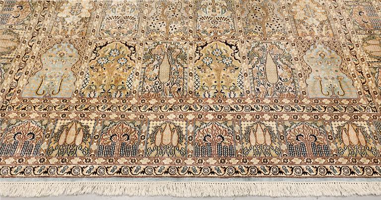 A Kashmir silk carpet, c. 310 x 214 cm.