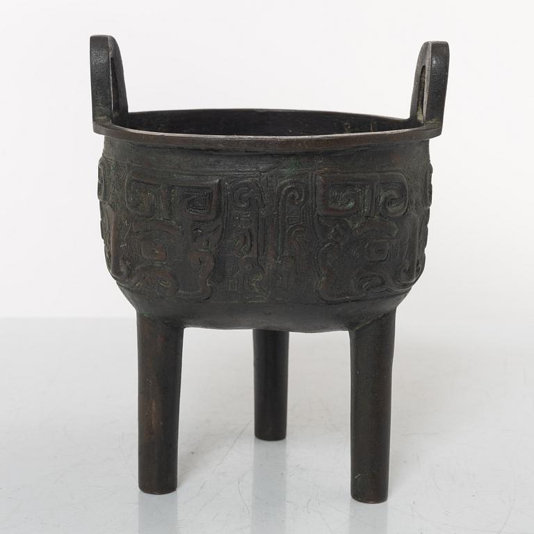 A Chinese tripod bronze censer, Ming style, Qing dynasty (1644-1912).