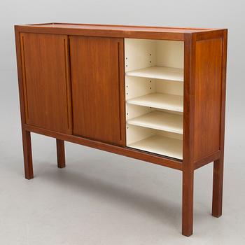 A mid-20th century cupboard 'Näyttely- astiakaappi' for HMN Huonekalu Mikko Nupponen, Lahti, Finland.