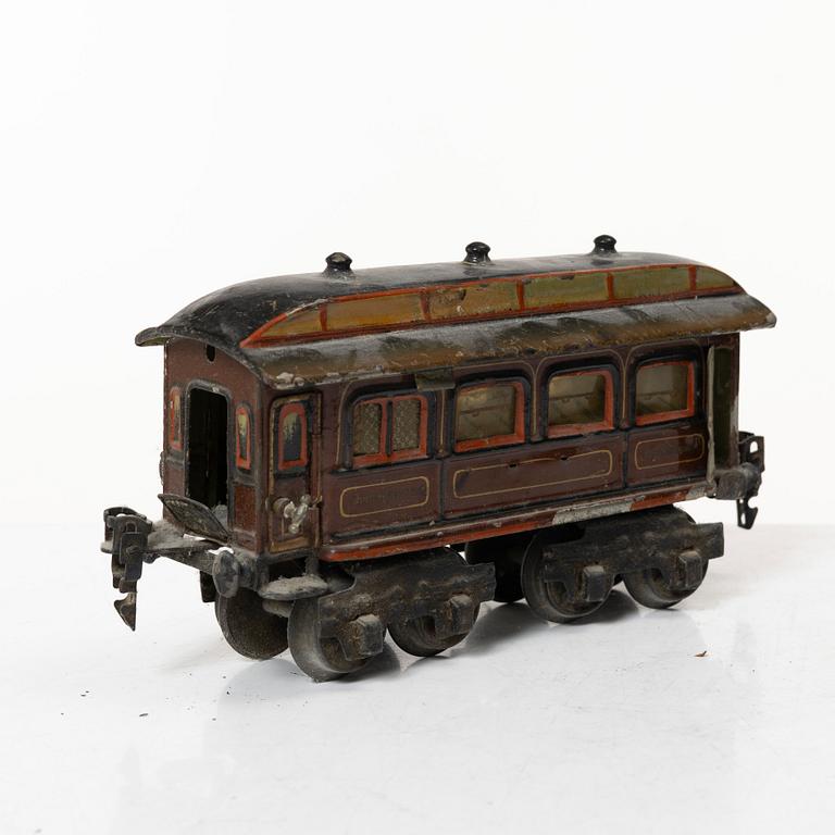 Model train with track and station building, 13 pieces, Germany, 1920s.