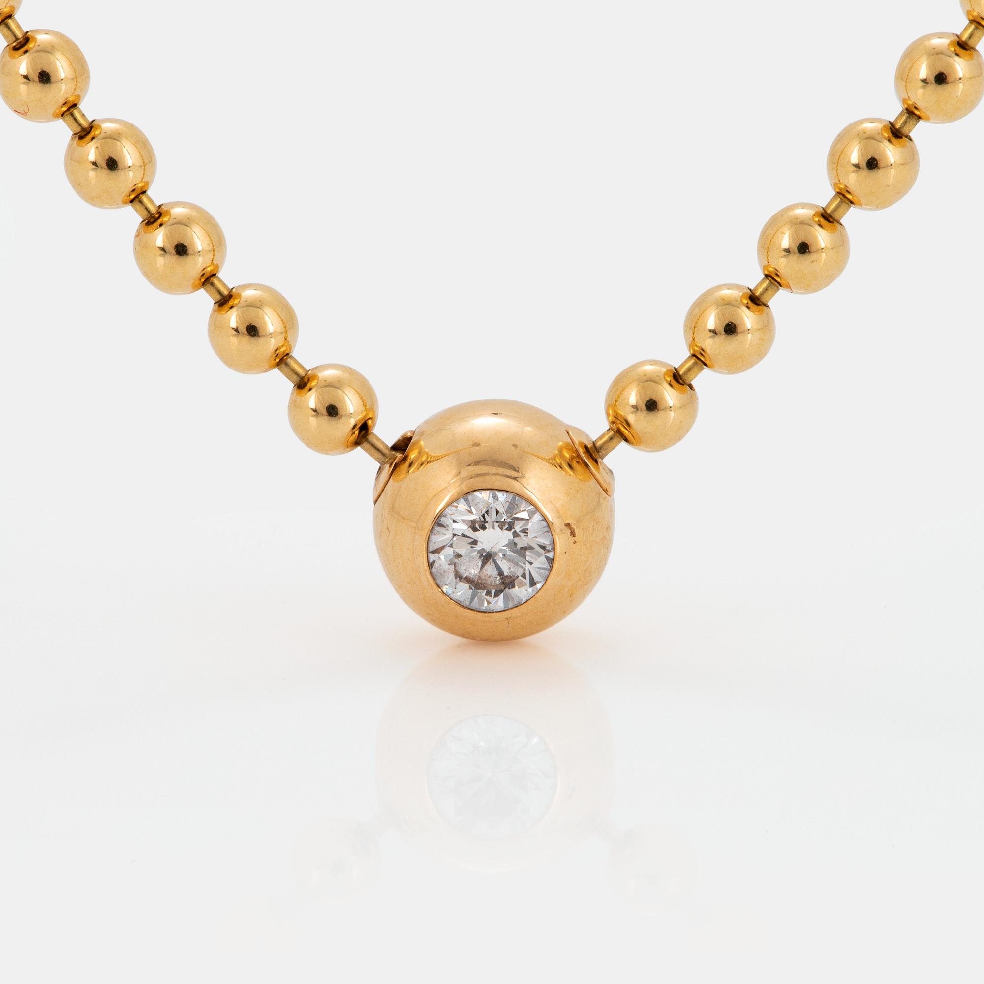 A Cartier "Pluie de Diamants" 18K gold necklace with a round brilliant-cut diamond.