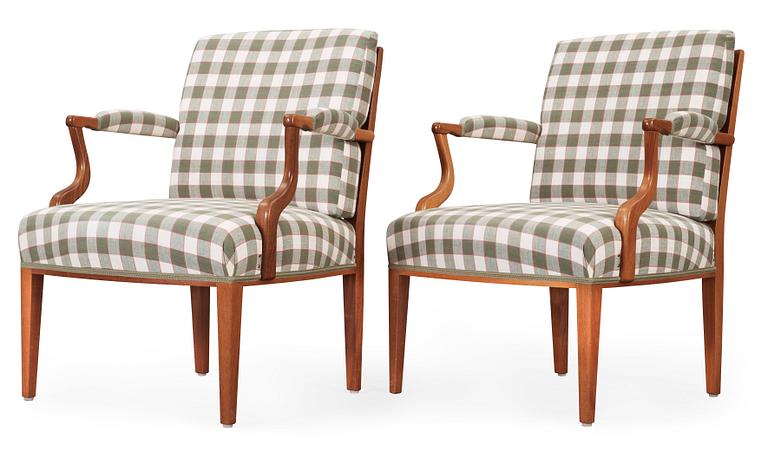 A pair of Josef Frank mahogany armchairs, Svenskt Tenn Sweden.