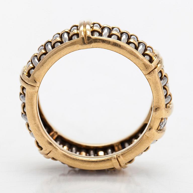 Cartier,an 18K gold and steel ring, with brilliant-cut diamonds.