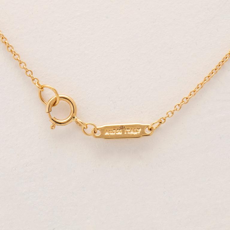 Tiffany & Co, halsband "T" 18K guld med en baguettslipad diamant.