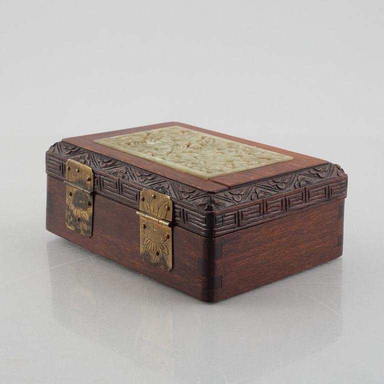 Two Chinese hardwood boxes with nephrite plaques, 20th century.