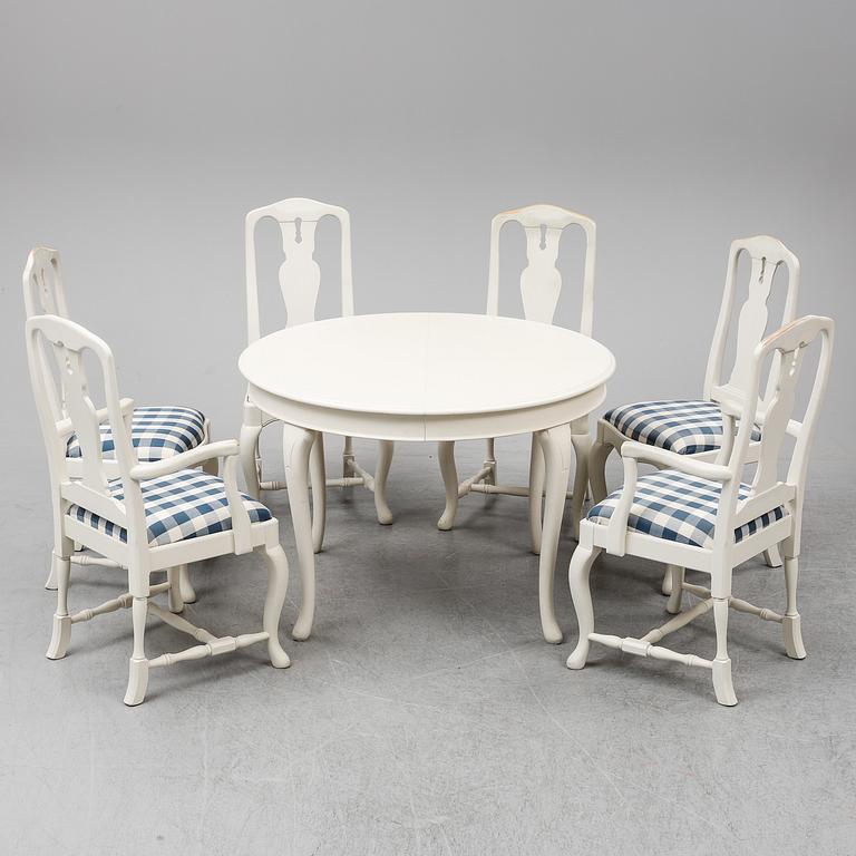 A rococo style dining table with 4+2 chairs.