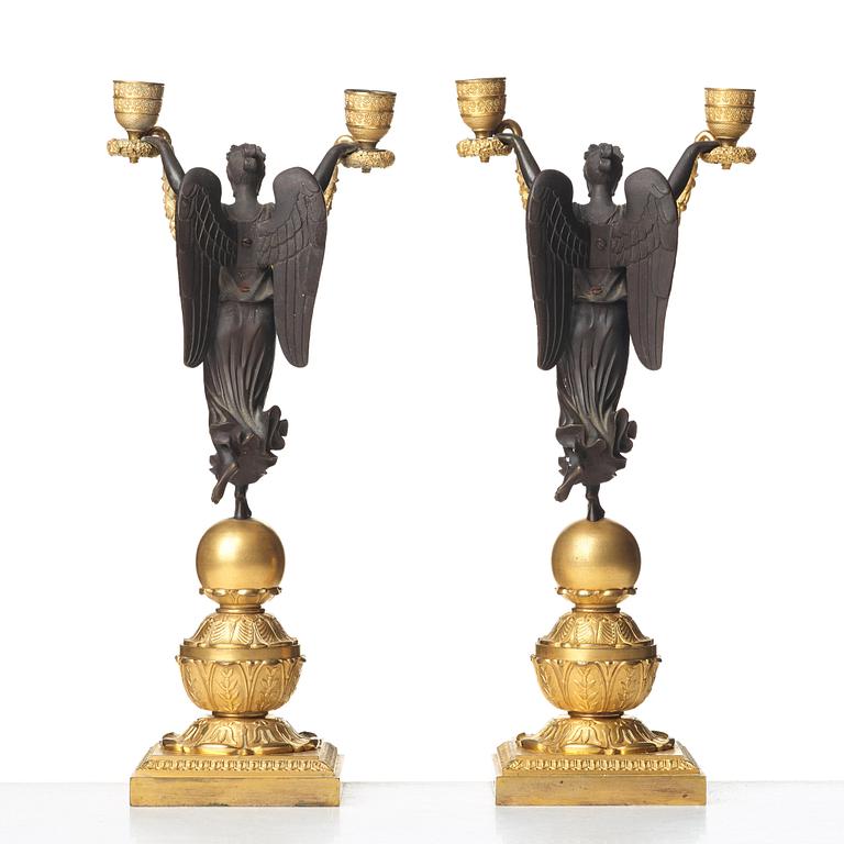 A pair of Empire two-light candlesticks, beginning of the 1800's.