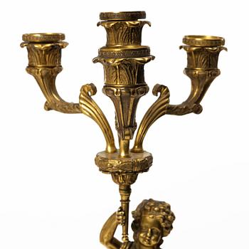 A pair of Empire style candelabra, circa 1900.