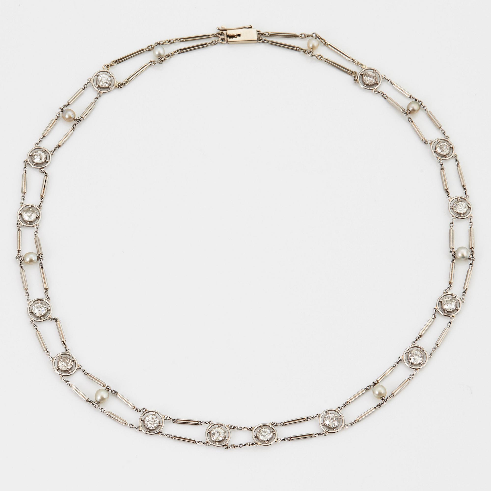 A NECKLACE with round brilliant-cut diamonds and pearls.
