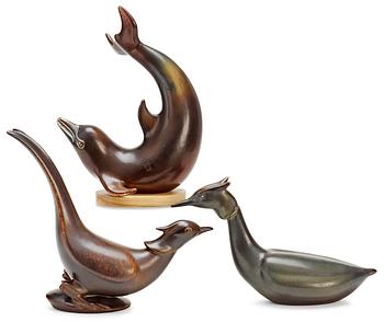 395. Three Gunnar Nylund stoneware figures, a dolphin, a pheasant and a great crested grebe, Rörstrand.