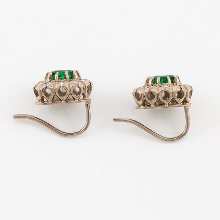 Earrings, carmosé. white gold with emeralds and brilliant-cut diamonds.