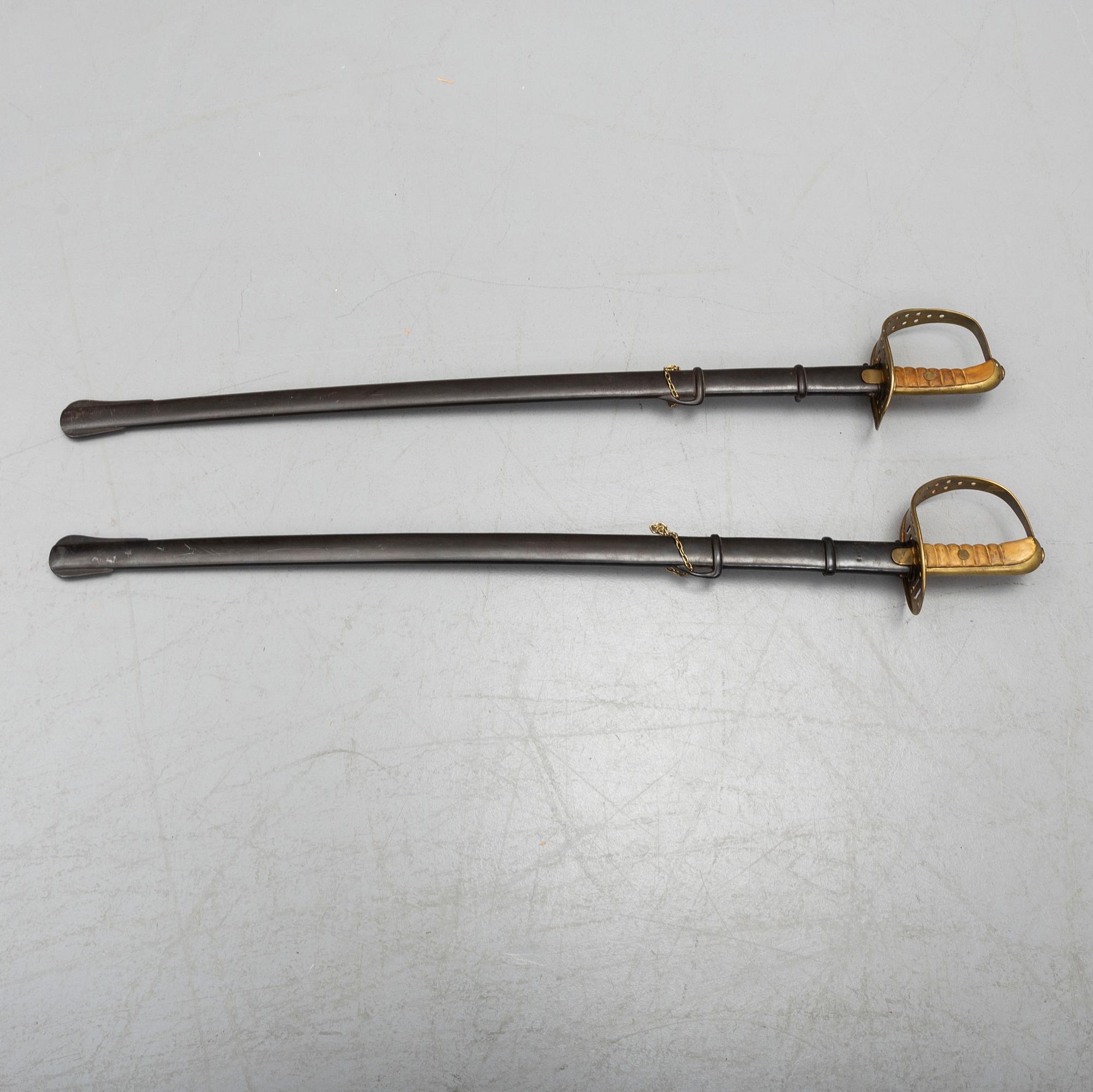 Two cavalry sabres 1867 pattern with scabbards.