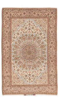 415. An Isfahan rug, part silk, signed Davari, c. 234 x 150 cm.