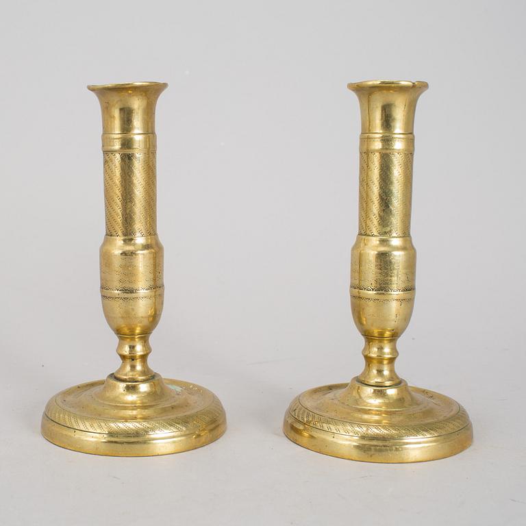 A 19th Century pair of brass candlesticks.