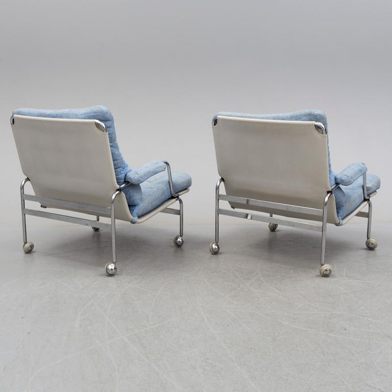 A pair of easy chairs with stool by Bruno Mathsson, DUX, late 20th century.