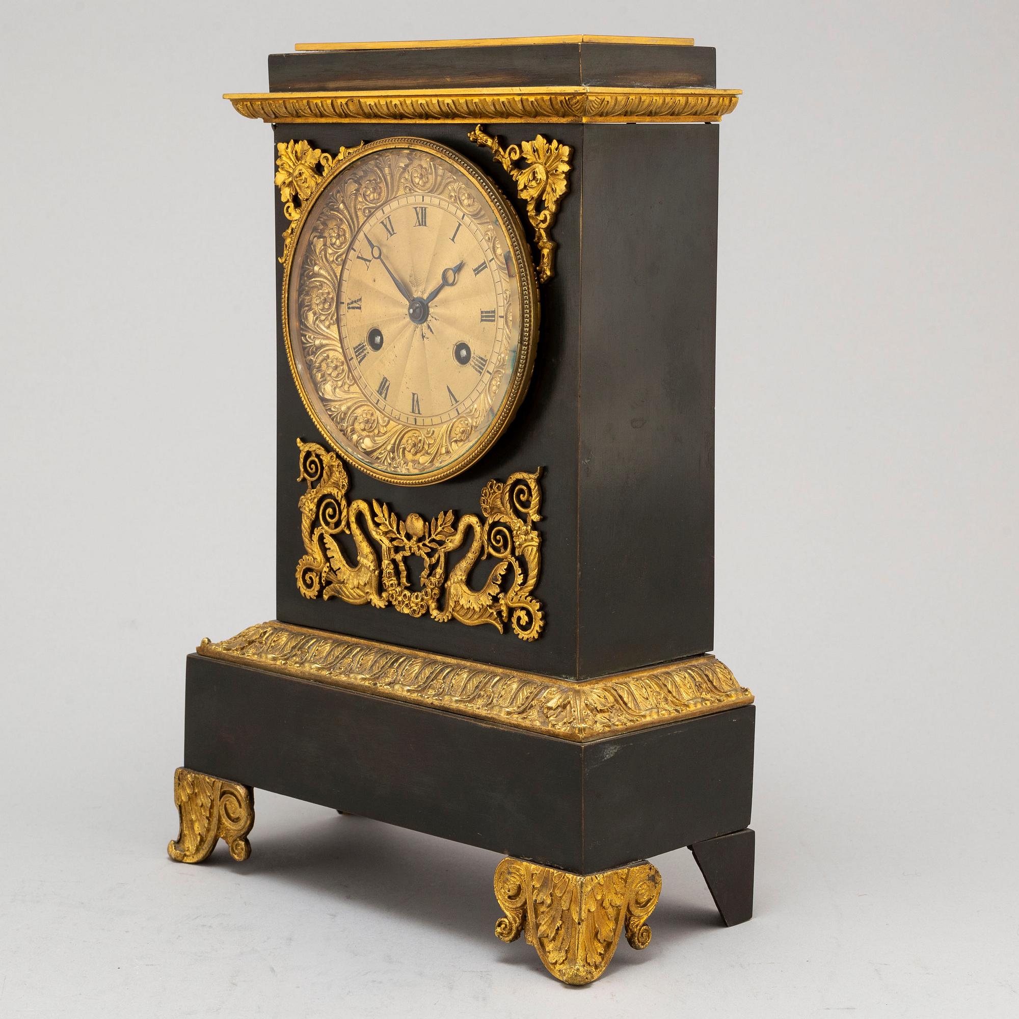 An Empire-style late 19th century mantel clock.