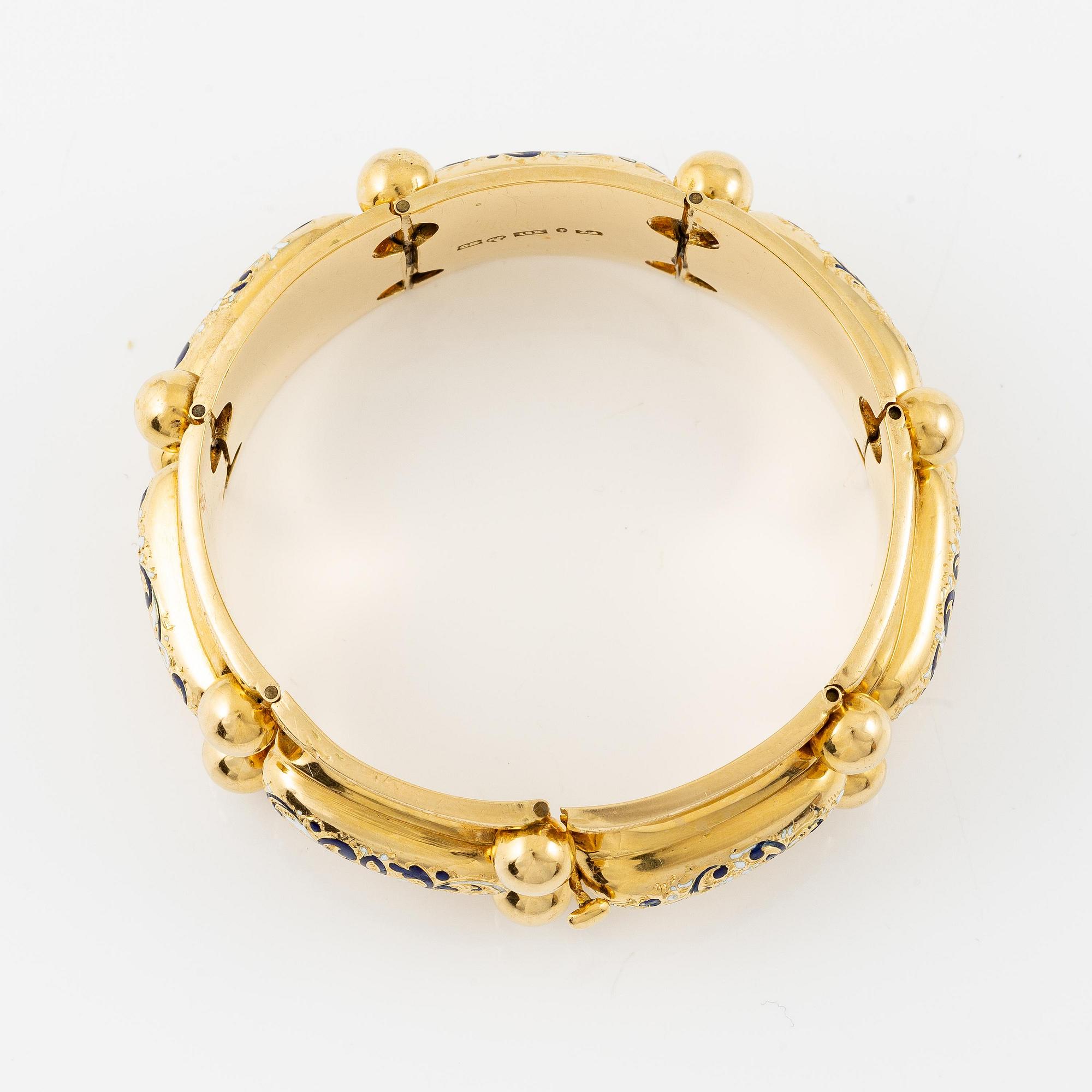 A bracelet 18K gold with enamel details.