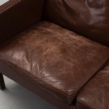 A two-seat leather sofa by Børge Mogensen for Fredrika Stolefabrik, Denmark.