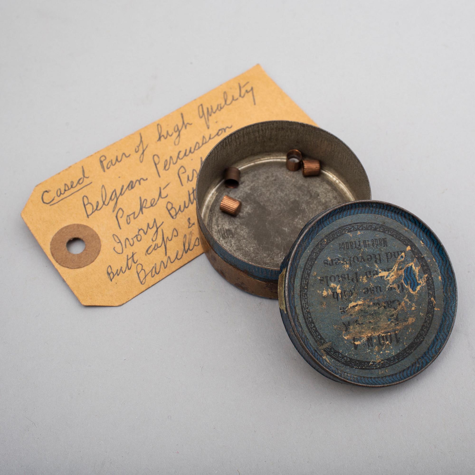 A mid 19th century Belgian rifled percussion pistols with ivory butts in a case.