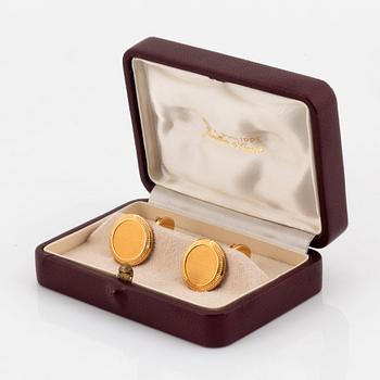 Patek Philippe, tie pin and cufflinks.