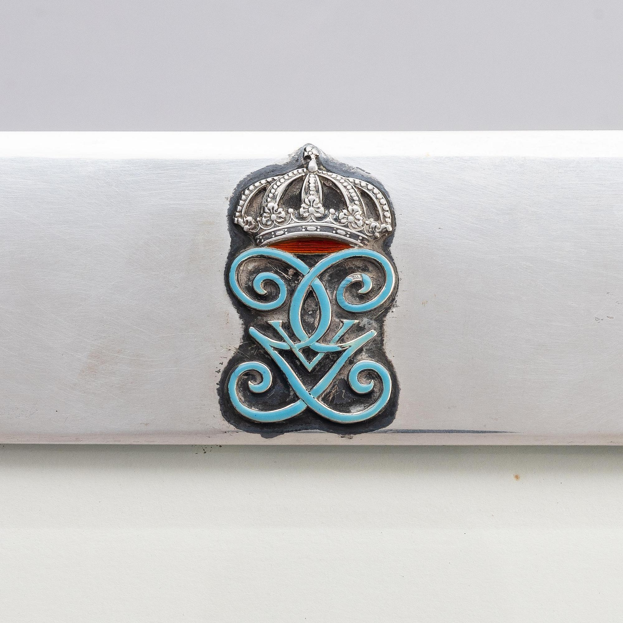 A silver and enamel frame with glass, mark of CG Hallberg, Stockholm 1937.