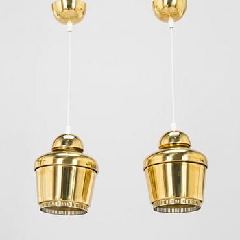 Alvar Aalto, A pair of  A 330, 'Golden Bell' pendant lights A330 for Artek, 2000s.