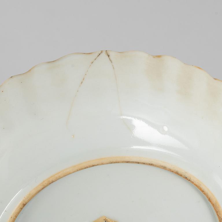 A blue and white export porcelain cup with saucer and four small dishes, China, Qing dynasty, 18th/19th century.