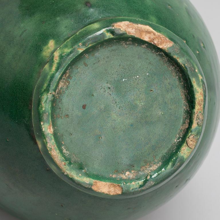 A green glazed ceramic bottle/jar, late Ming dynasty.