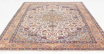 A semi-antique Tabriz carpet, 361 x 235 cm.