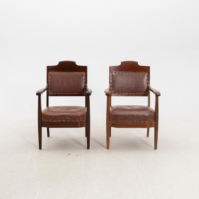 A pair of early 1900s armchairs.