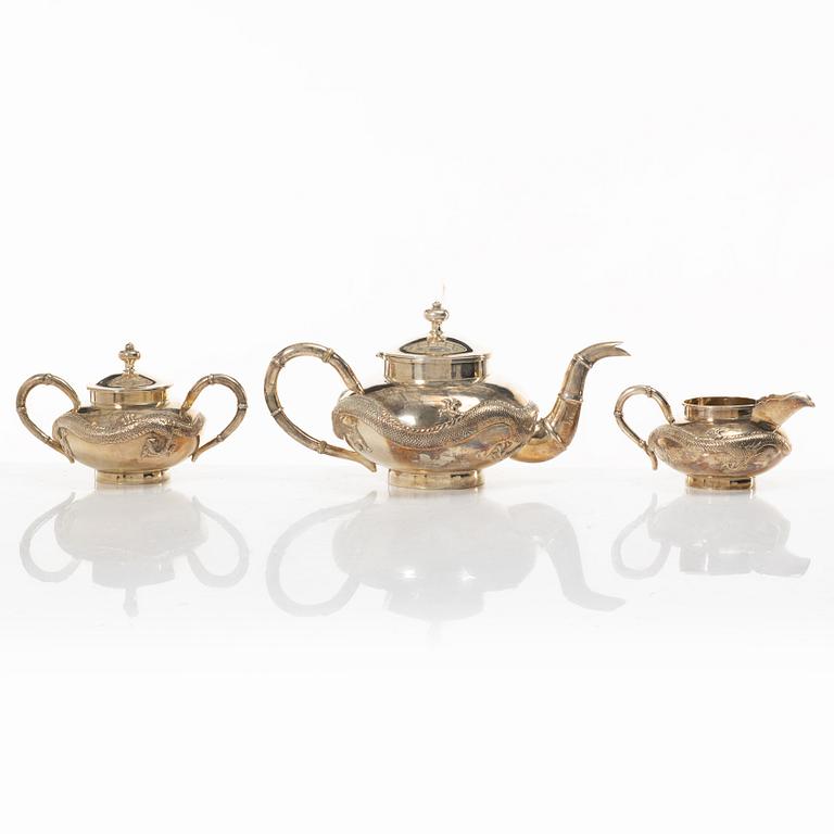 A three-piece Chinese silver tea service, Shanghai, early 20th Century.