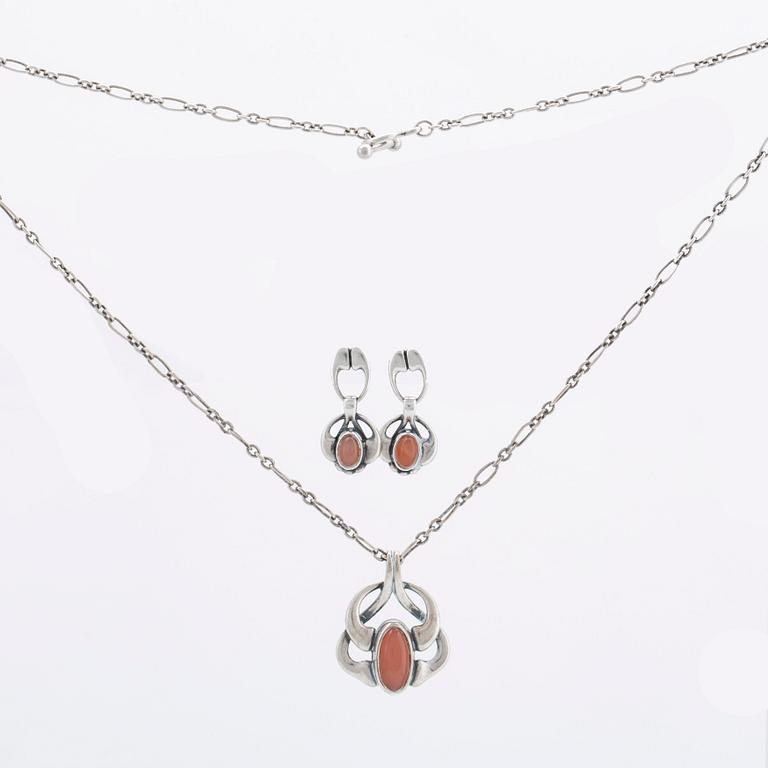 A silver and moonstone jewellery set consisting of necklace and earrings by Georg Jensen, jewellery of the year 2006.