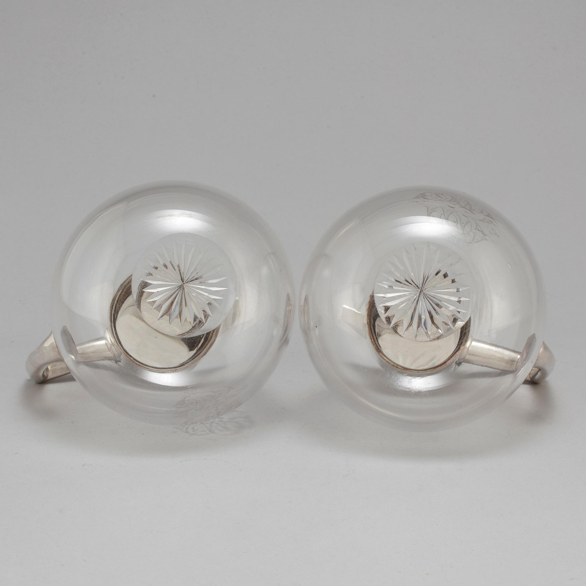 A pair of caraffes with silver mountings by CG Hallberg, Stockholm 1890.