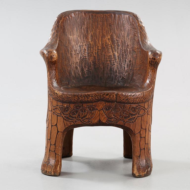 A Gustaf Fjaestad Art Nouveau carved pine chair 'Stabbestol', by Adolf Swanson, Arvika, Sweden 1908.