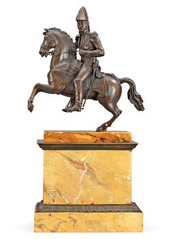 671. A French first half 19th century equestrian bronze and Sienna marble veneered statue.