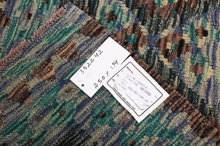 A Kilim rug, c. 250 x 194 cm.