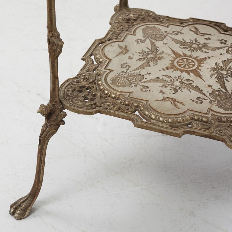 A three-tiered metal pedestal, first half of the 20th century.