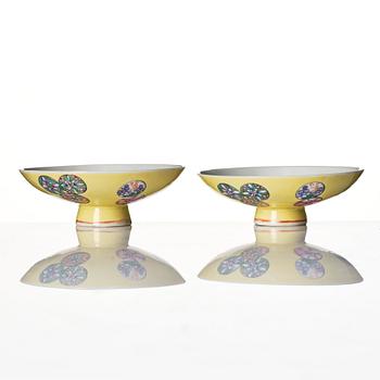 A pair of yellow glazed covers, late Qing dynasty, with Qianlong mark.