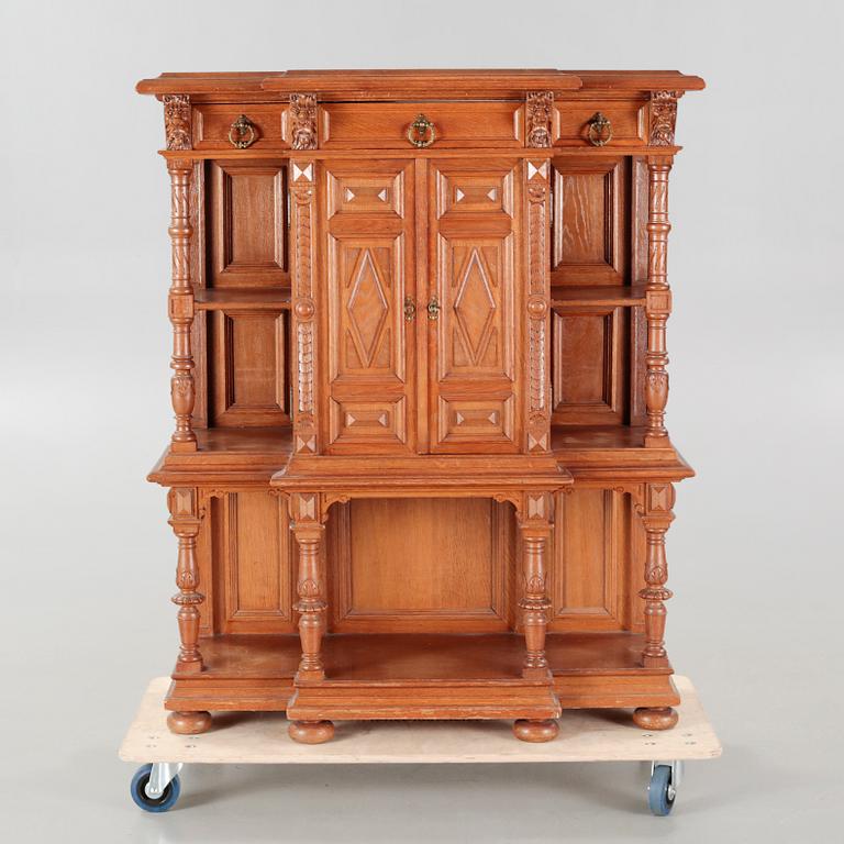 A cabinet in baroque style, made in the first half of the 20th century.