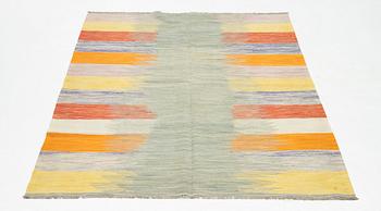 A kilim rug, ca 252 x 175 cm.