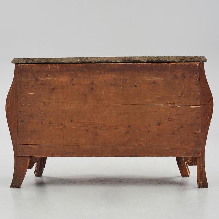 A rococo rosewood-veneered and ormolu-mounted commode by N. Korp (master 1763-1800).