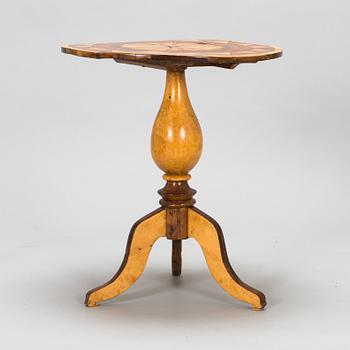 A tilt top table from 19th Century.