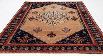 An oriental carpet, c. 325 x 210 cm.